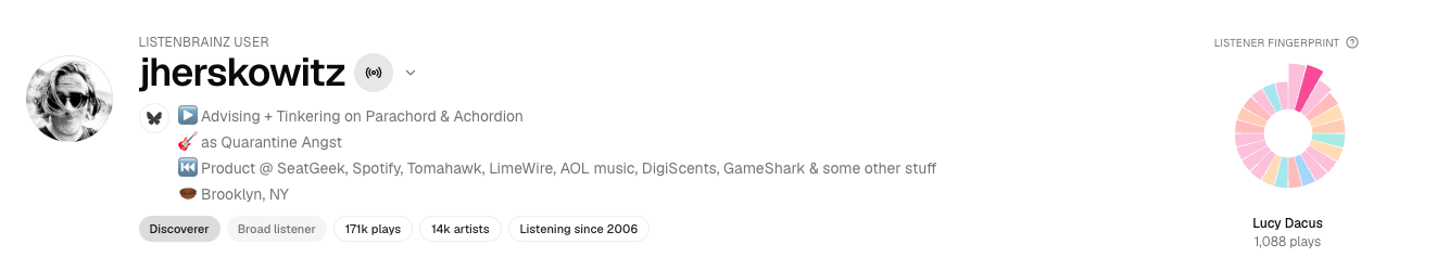 Achordion profile header showing the auto-bio sentence, archetype + milestone chips, the colorful listener fingerprint glyph, and the user's currently-playing track.